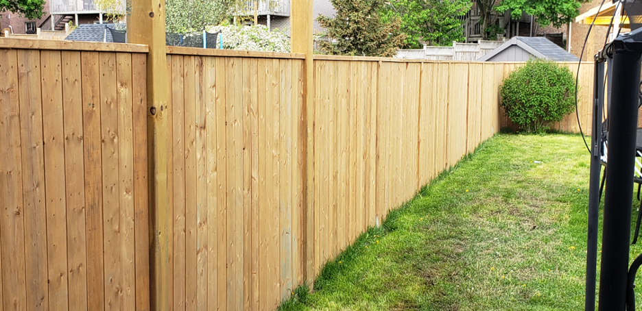 New wooden fence in a backyard in Glenview, Illinois